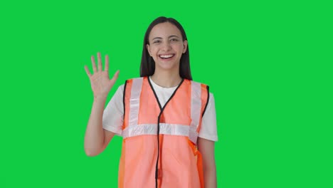 Happy-Indian-ground-staff-girl-waving-Hi-Green-screen