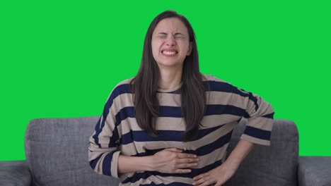 Sick-Indian-girl-suffering-from-stomach-pain-Green-screen