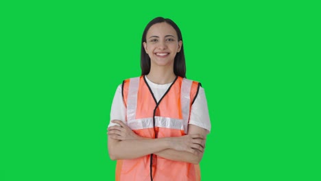 Confident-Indian-airport-ground-staff-standing-crossed-hands-Green-screen