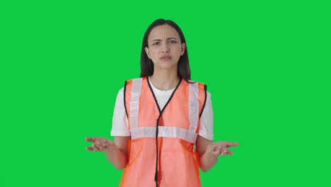 Airport-ground-staff-girl-worker-giving-instructions-Green-screen