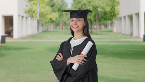 Portrait-of-Happy-Indian-college-graduate-girl-standing-crossed-hands