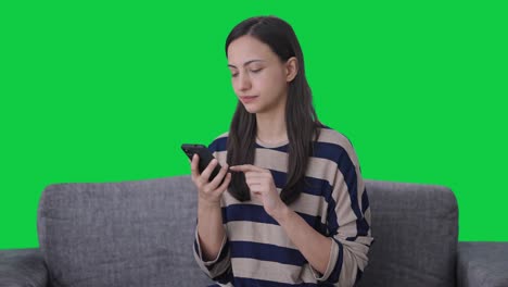 Indian-girl-using-mobile-phone-Green-screen