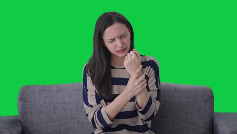 Sick-Indian-girl-suffering-from-hand-pain-Green-screen