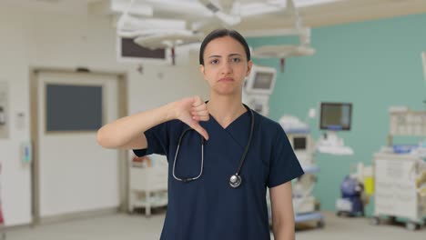 Disappointed-Indian-female-doctor-showing-thumbs-down