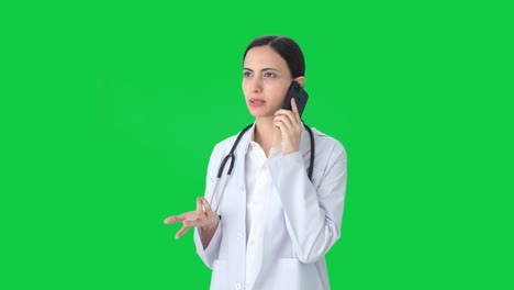 Indian-female-doctor-talking-on-call-Green-screen