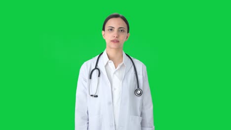 Indian-female-doctor-talking-to-the-camera-Green-screen