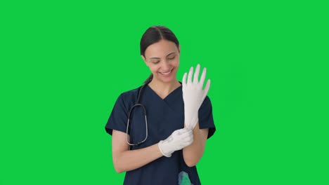 Happy-Indian-female-doctor-getting-ready-for-operation-Green-screen