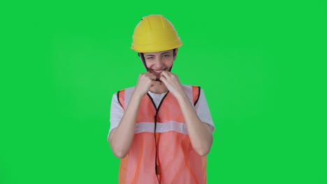 Happy-Indian-female-construction-worker-wearing-helmet-Green-screen