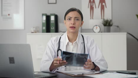 Angry-Indian-female-doctor-explaining-X-ray-report-to-patient