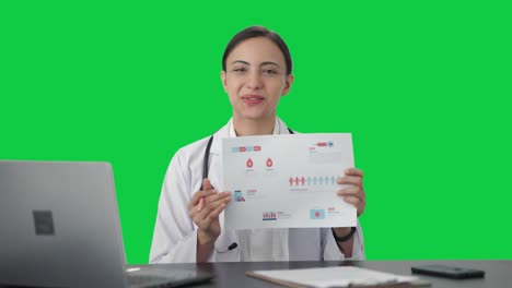 Happy-Indian-female-doctor-explaining-medical-report-to-patient-Green-screen
