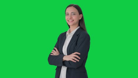 Portrait-of-happy-Indian-business-woman-standing-crossed-hands-Green-screen