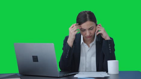 Angry-Indian-female-manager-shouting-on-mobile-phone-Green-screen