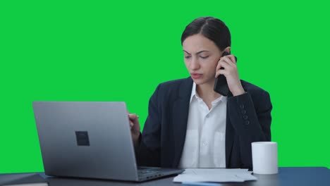 Serious-Indian-female-manager-talking-on-mobile-phone-Green-screen