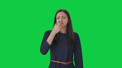 Sick-Indian-girl-measuring-fever-using-thermometer-Green-screen
