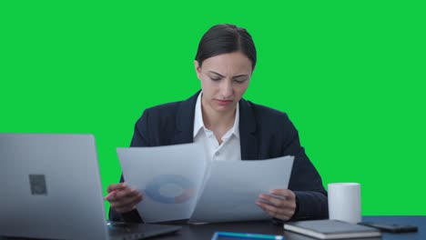 Confused-Indian-business-woman-signing-a-contract-Green-screen