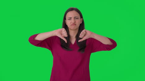 Upset-Indian-woman-showing-thumbs-down-Green-screen