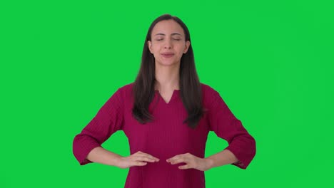Happy-Indian-girl-relaxing-and-taking-long-breaths-Green-screen