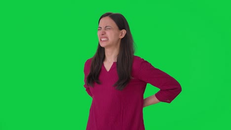 Sick-Indian-woman-suffering-from-back-pain-Green-screen