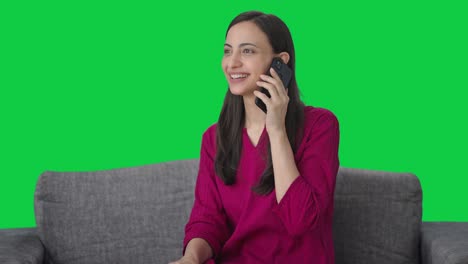 Happy-Indian-woman-talking-with-someone-on-call-Green-screen