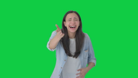 Happy-Indian-girl-laughing-on-someone-Green-screen