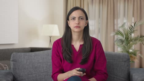Sad-Indian-woman-watching-TV