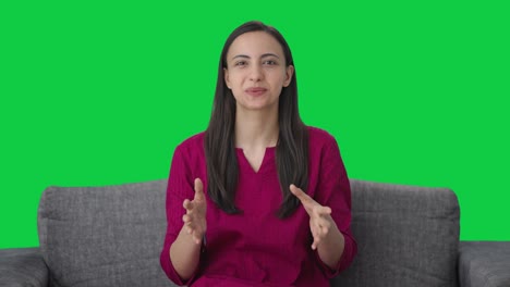 Happy-Indian-woman-talking-to-someone-Green-screen