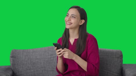 Happy-Indian-woman-chatting-with-someone-Green-screen