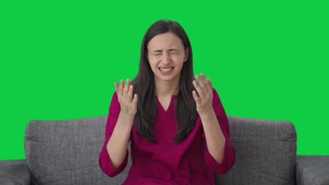 Disappointed-Indian-woman-slapping-her-head-Green-screen