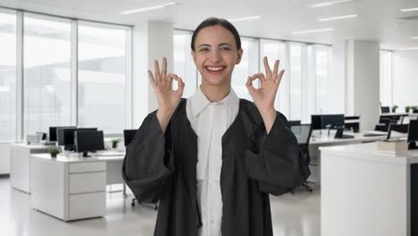 Happy-Indian-female-lawyer-showing-okay-sign