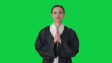 Happy-Indian-female-lawyer-doing-Namaste-Green-screen