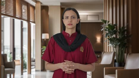 Indian-female-hotel-staff-listening-to-someone