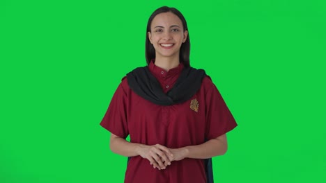 Happy-Indian-female-housekeeper-smiling-Green-screen