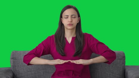 Indian-woman-doing-breathe-in-breathe-out-exercise-Green-screen