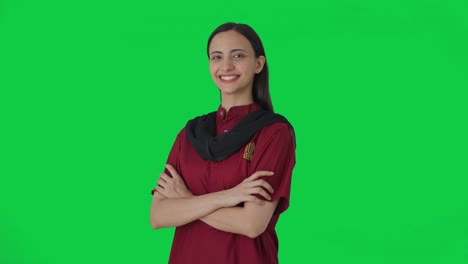 Portrait-of-Happy-Indian-female-housekeeper-standing-crossed-hands-Green-screen