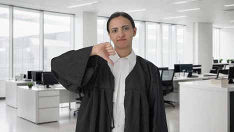 Upset-Indian-female-lawyer-showing-thumbs-down