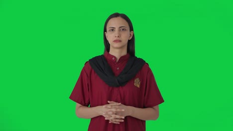 Indian-female-hotel-staff-listening-to-someone-Green-screen