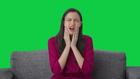 Sick-Indian-woman-suffering-from-tooth-pain-Green-screen