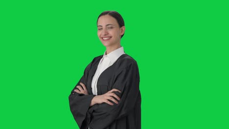 Portrait-of-Happy-Indian-female-lawyer-standing-crossed-hands-Green-screen
