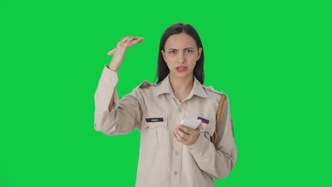 Indian-female-police-officer-writing-details-of-case-Green-screen
