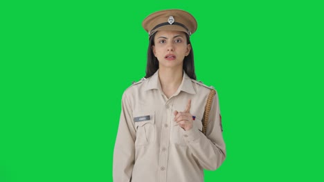 Indian-female-police-officer-talking-Green-screen