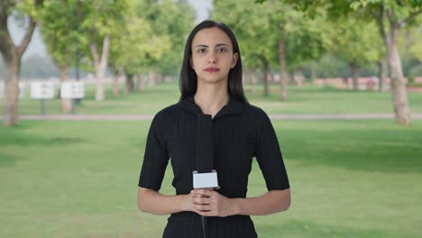 Indian-female-news-reporter-looking