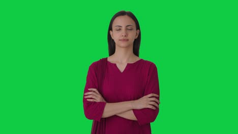 Portrait-of-Indian-female-teacher-standing-crossed-hands-Green-screen