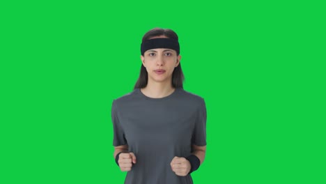 Serious-Indian-girl-doing-jogging-Green-screen