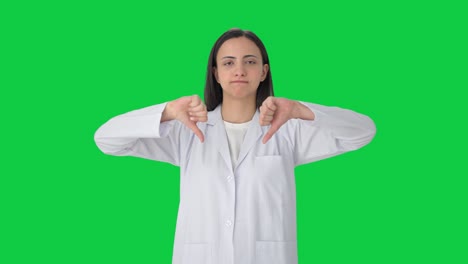 Upset-Indian-female-scientist-showing-thumbs-down-Green-screen