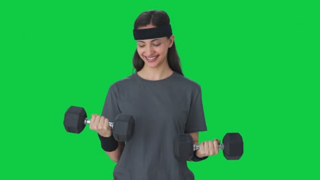 Happy-Indian-girl-lifting-heavy-dumbbells-Green-screen