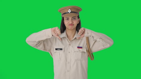 Upset-Indian-female-police-officer-showing-thumbs-down-Green-screen