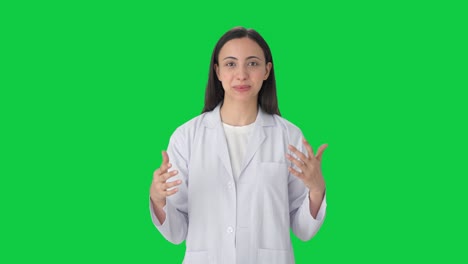 Happy-Indian-female-scientist-talking-to-the-camera-Green-screen