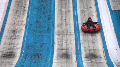 Kiev-Ukraine---January-11,-2021:-mountain-for-descent-on-an-inflatable-ring-on-the-territory-of-the-National-Complex-Expocenter-of-Ukraine-VDNH