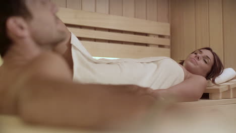 Couple-resting-in-hot-sauna