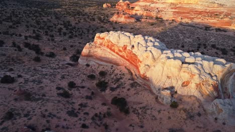 Rough-terrain-with-scenic-cliffs-and-sandy-desert-at-sundown-in-USA